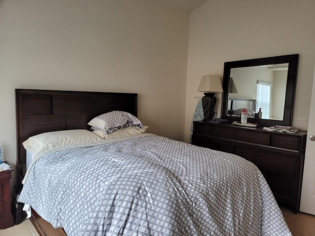 bedroom featuring light tile patterned floors