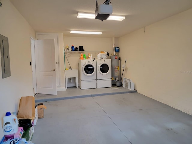 garage with electric panel, water heater, a garage door opener, and independent washer and dryer