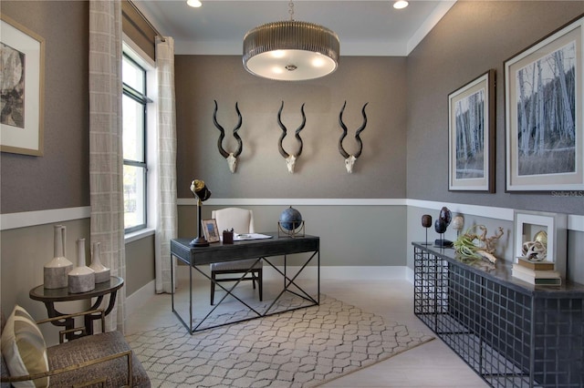 home office featuring ornamental molding, light wood-type flooring, and plenty of natural light