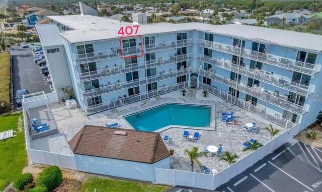 pool featuring a patio area and fence