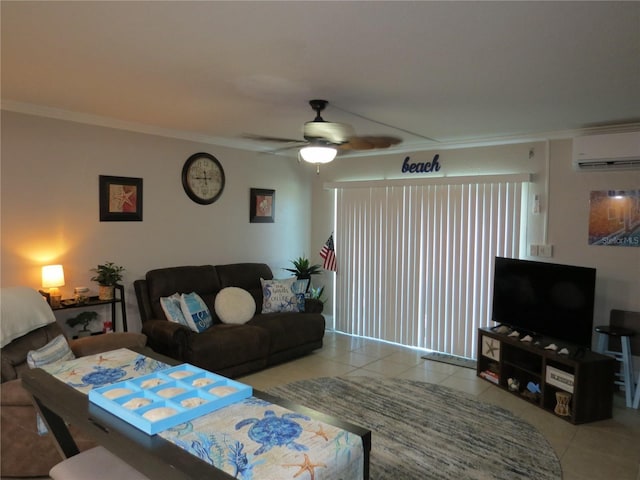 living area featuring ornamental molding, a wall mounted air conditioner, a ceiling fan, and tile patterned floors