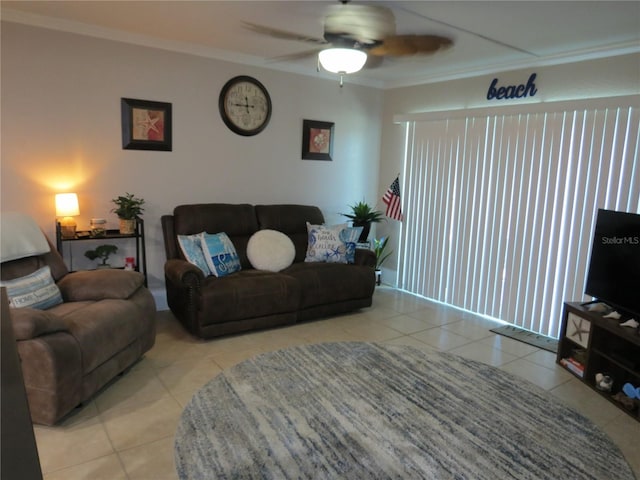 living room featuring ceiling fan, ornamental molding, and tile patterned floors