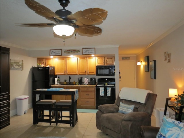 kitchen with black appliances, light tile patterned flooring, a sink, and crown molding