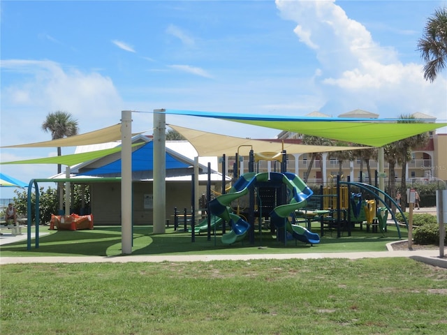 community play area featuring a lawn