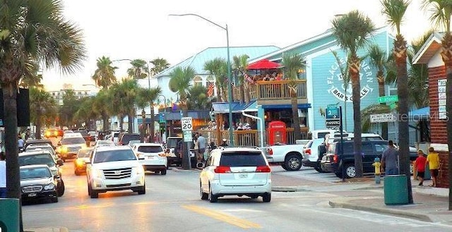 view of road with sidewalks and street lights