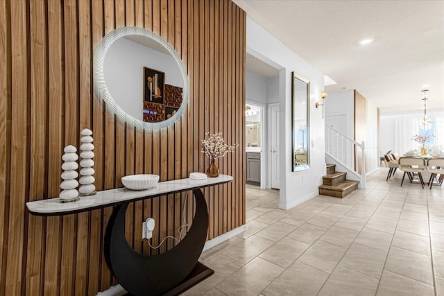 corridor featuring light tile patterned flooring