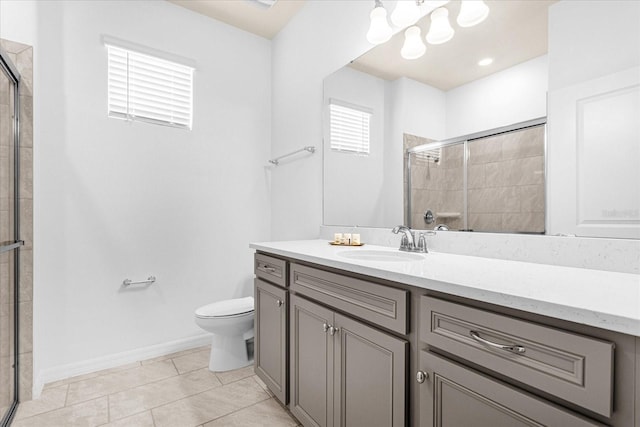 bathroom with tile patterned flooring, a shower with door, toilet, and vanity