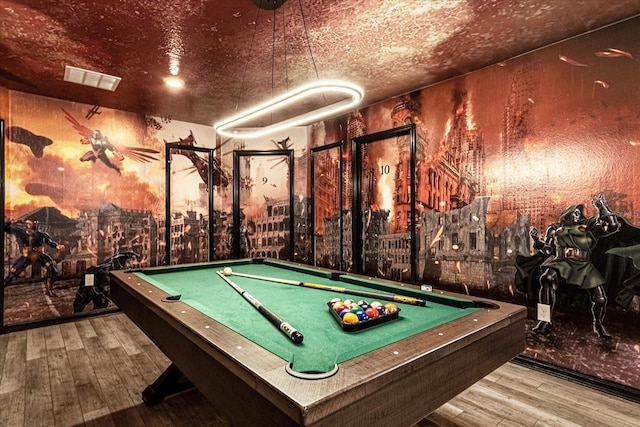 rec room featuring wood-type flooring, a textured ceiling, and billiards