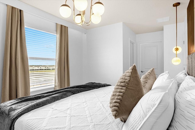 bedroom with a chandelier