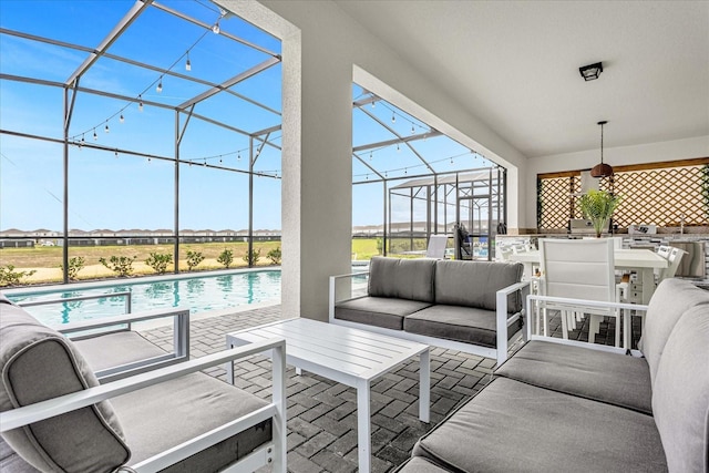 view of patio / terrace featuring glass enclosure and an outdoor living space