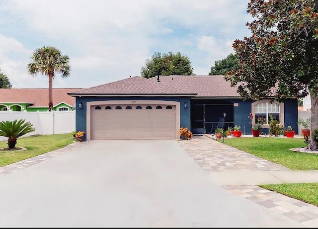 2019 Jaffa Ct, Clermont, FL 34714 - ranch-style house with a garage, stucco siding, a shingled roof, and driveway