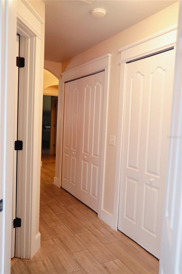 hallway featuring light wood-type flooring