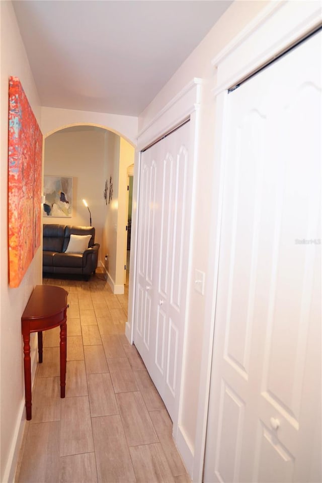 2019 Jaffa Ct, Clermont, FL 34714 - hall featuring arched walkways and baseboards