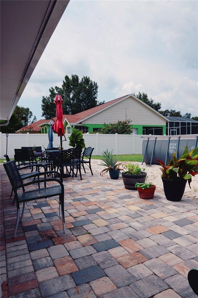 2019 Jaffa Ct, Clermont, FL 34714 - fenced backyard with a patio and outdoor dining area
