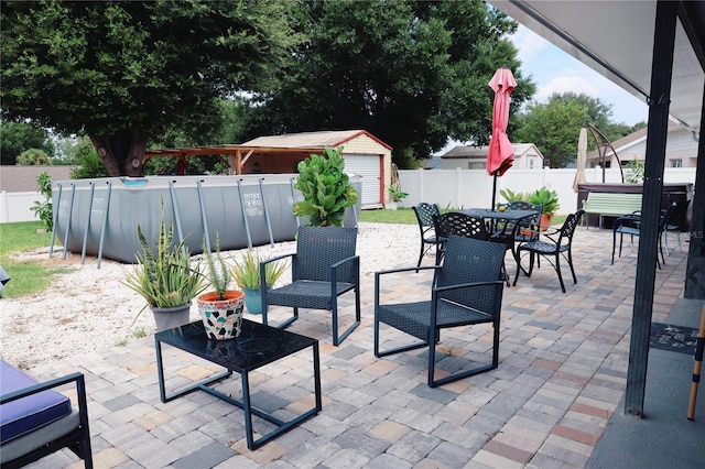 view of patio / terrace featuring a storage shed