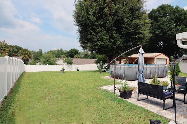2019 Jaffa Ct, Clermont, FL 34714 - fenced backyard with a patio