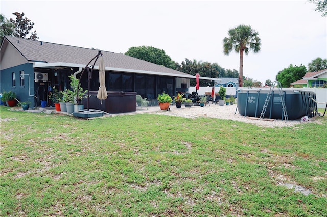 view of yard with a swimming pool and a sunroom