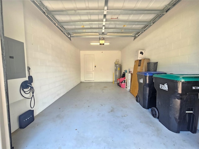 garage featuring a garage door opener, electric panel, and water heater