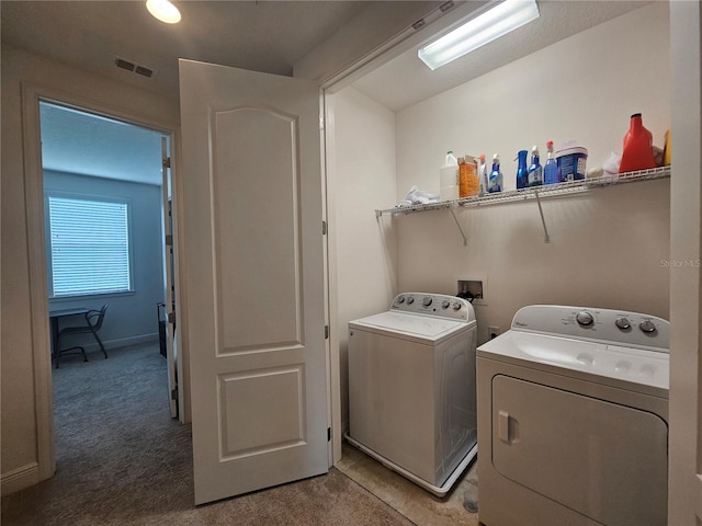 washroom featuring carpet and independent washer and dryer