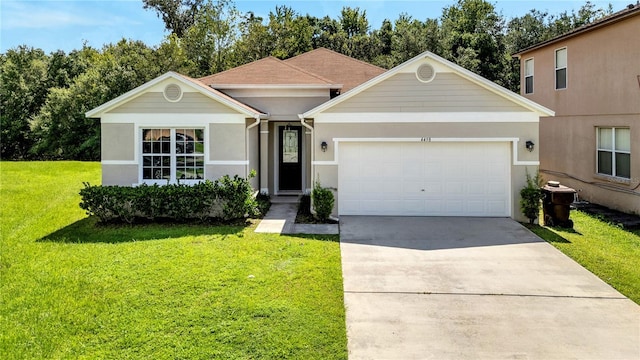 view of front of property featuring a garage and a front lawn