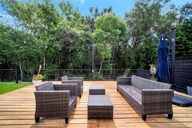 wooden terrace with outdoor lounge area