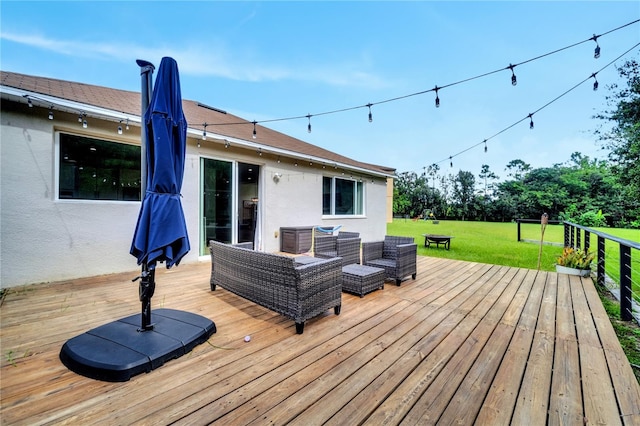 wooden terrace with an outdoor hangout area and a yard