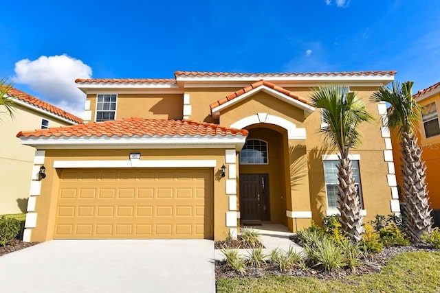 401 Cabello Dr, Davenport, FL 33837 - mediterranean / spanish-style home featuring stucco siding, concrete driveway, a garage, and a tiled roof