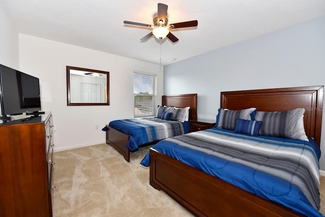 401 Cabello Dr, Davenport, FL 33837 - bedroom with baseboards, light colored carpet, and ceiling fan