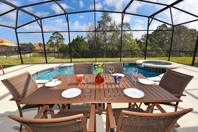 view of swimming pool featuring an in ground hot tub, a patio, and a lanai