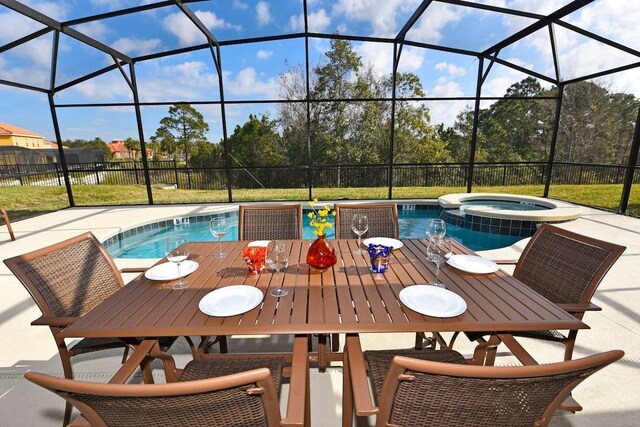 401 Cabello Dr, Davenport, FL 33837 - view of pool featuring a pool with connected hot tub, outdoor dining area, a lanai, and a patio