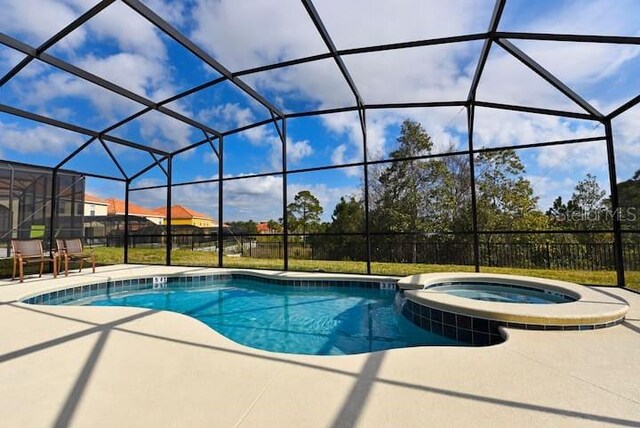 401 Cabello Dr, Davenport, FL 33837 - view of swimming pool with a patio area, a pool with connected hot tub, and a lanai