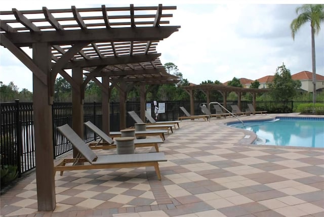 view of pool with a patio area and a pergola