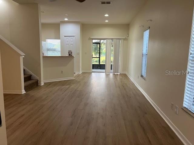 unfurnished living room featuring hardwood / wood-style floors