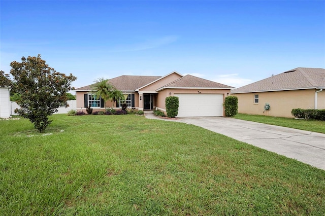 ranch-style home featuring a garage and a front lawn