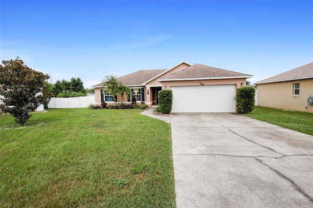 ranch-style house featuring a garage and a front yard