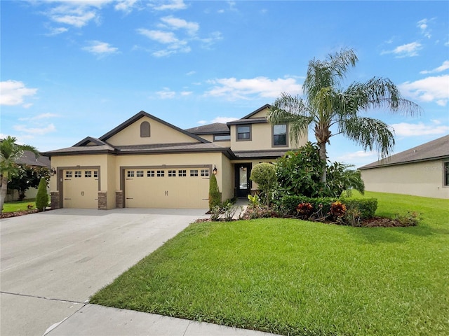 view of front of property with an attached garage, stucco siding, driveway, and a front yard