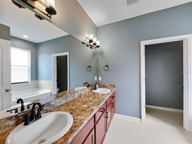 full bath featuring double vanity, a sink, and toilet