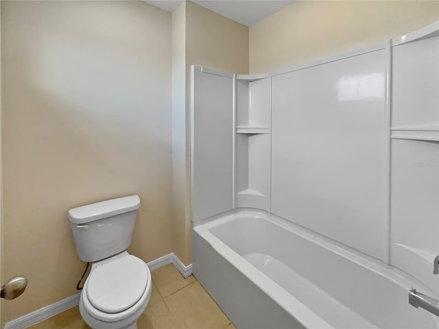 bathroom with baseboards, shower / bath combination, toilet, and tile patterned floors