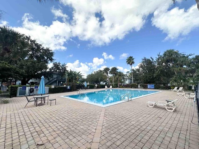 view of swimming pool with a patio area