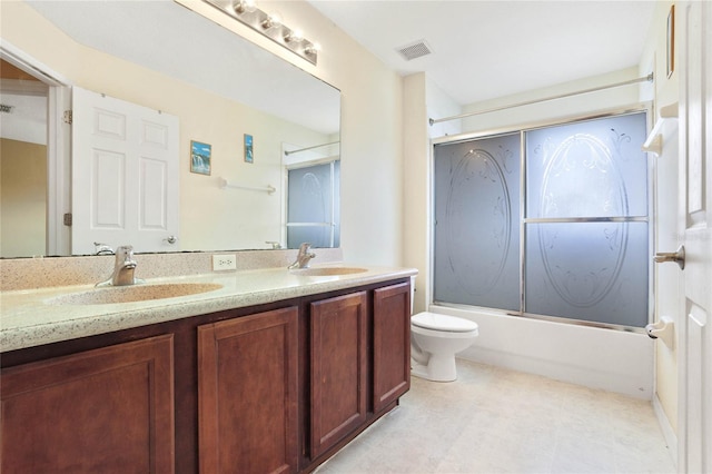 full bathroom featuring vanity, toilet, and enclosed tub / shower combo