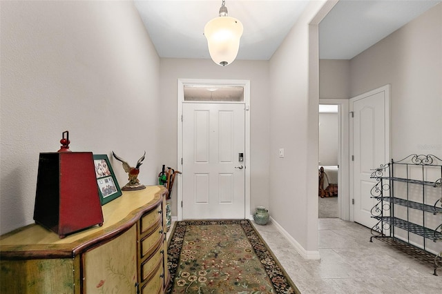 view of tiled foyer entrance