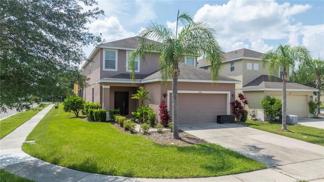 view of front of house with a garage and a front yard