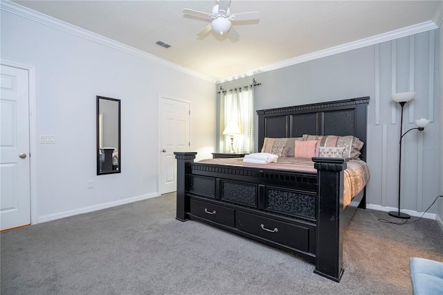 carpeted bedroom with ceiling fan and crown molding