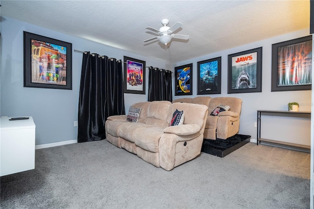 carpeted bedroom with ceiling fan and a textured ceiling