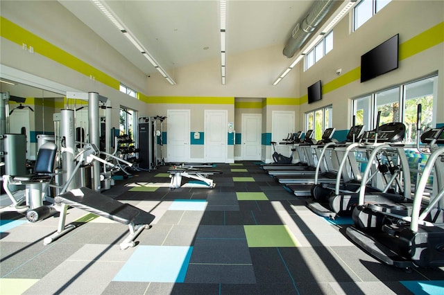 gym with a towering ceiling