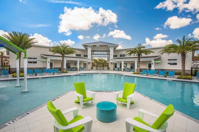 view of pool featuring a patio area and pool water feature