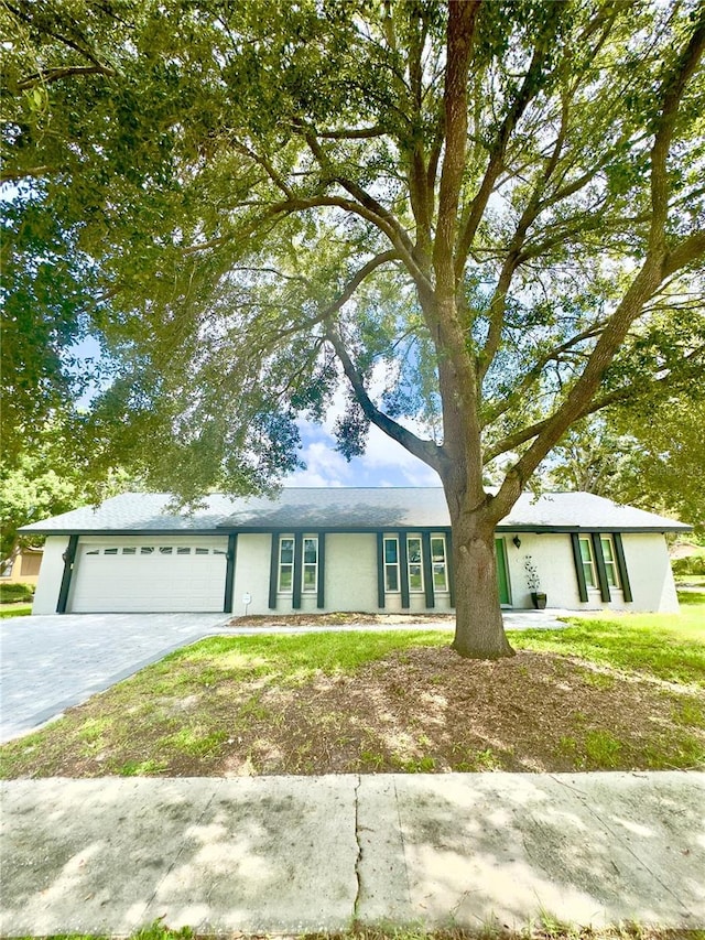 single story home with a garage