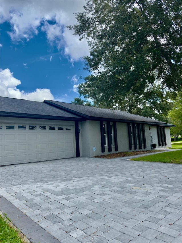 ranch-style home with a garage