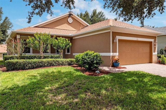 view of front facade featuring a garage and a front lawn