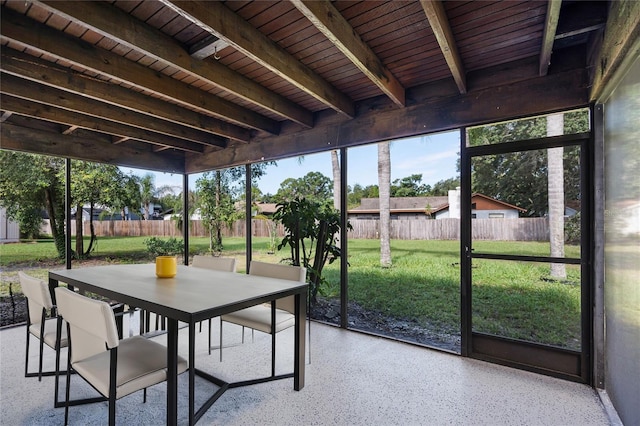 unfurnished sunroom with wood ceiling and beam ceiling